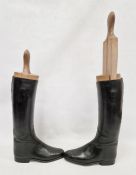 Pair of black leather riding boots with wooden trees, stamped 8 1/2 D / 3532 7, the trees incised
