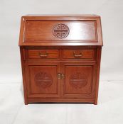 Chinese rosewood bureau with fall front, fitted interior of two short drawers and cupboard below,