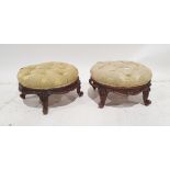 Pair of Victorian circular low stools the button upholstered pale yellow, carved scroll to four