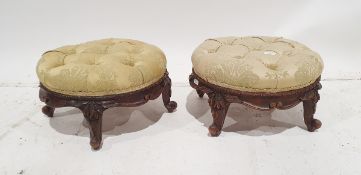 Pair of Victorian circular low stools the button upholstered pale yellow, carved scroll to four