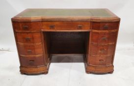 20th century oak kneehole writing desk having central frieze drawer, an arrangement of eight drawers
