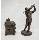 Resin model of a golfer in full swing, 22 cms high, and curious lead, lidded pot, with repousse