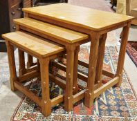 Nest of three Robert Thompson 'Mouseman' oak trio coffee tables, each rectangular with rounded