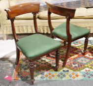 Set of four Victorian mahogany dining chairs with carved shoulderboards, on panelled tapering
