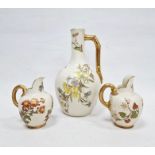 Three Royal Worcester ivory ground jugs, late 19th century, printed green and puce marks, shape