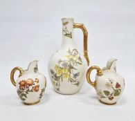 Three Royal Worcester ivory ground jugs, late 19th century, printed green and puce marks, shape