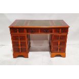 Reproduction yew wood pedestal desk with tooled green leather top above a frieze drawer flanked by