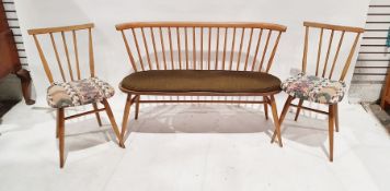 20th century Ercol window seat with spindle back to moulded seat on stretchered supports on tapering