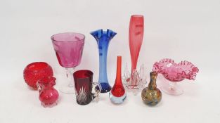 Group of engraved and coloured glassware to include an amethyst tinted goblet on clear stem etched