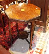 Edwardian mahogany octagonal two-tier table on castors, inlaid (one castor loose)