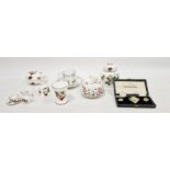 Royal Crown Derby porcelain flower-encrusted brooch and clip-on earrings in original leather case