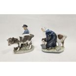 Royal Copenhagen porcelain model of a milkmaid and another of a farmer with cow, printed blue and