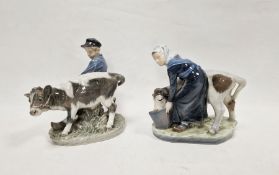 Royal Copenhagen porcelain model of a milkmaid and another of a farmer with cow, printed blue and