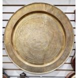 Large brass circular tray or table top, with oriental engraved decorations, featuring insects, birds