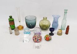 Assorted paperweights and coloured glassware, including blue tinted eye bath, five small medicine