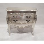 Modern French-style silvered chest of two drawers with shaped top with applied floral friezes on