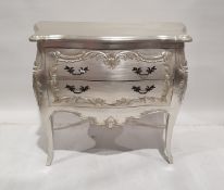 Modern French-style silvered chest of two drawers with shaped top with applied floral friezes on
