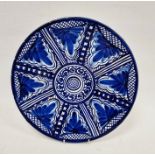20th century Mexican pottery charger, impressed marks M.F. Pintado a Mano, painted with stylised