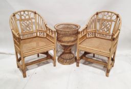Four modern bamboo cane seated armchairs together with a similar cane table base