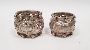 Two similar early 20th century napkin holders, pierced decoration with beaded rims, one inscribed '
