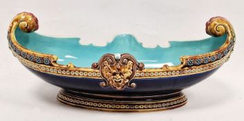 Sarreguemines majolica boat-shaped dish, circa 1870, impressed marks, shape no. 1972, with beast