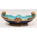 Sarreguemines majolica boat-shaped dish, circa 1870, impressed marks, shape no. 1972, with beast