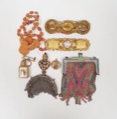 Two silver-coloured chain purses, an amber-coloured beaded necklace, two gilt-coloured buckles,