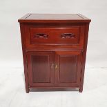 Chinese rosewood side cabinet having fall front with incised scroll carved handles, cupboard below