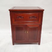 Chinese rosewood side cabinet having fall front with incised scroll carved handles, cupboard below
