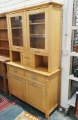 Modern beech dresser with two glazed cupboards over two central short drawers on rectangular base
