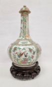 19th century Canton lidded onion-shaped vase in famille rose colours, the body decorated with
