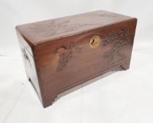 Chinese carved camphorwood chest, the top carved with birds and palm trees, the front and sides with