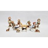 Group of Hummel figures of children at various pursuits, one little girl climbing a tree, Beswick