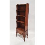 Early 20th century mahogany waterfall open front bookcase with three shelves over single drawer,