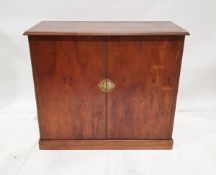 Early to mid 20th century oak cabinet with double doors revealing shelf, later pierced brass