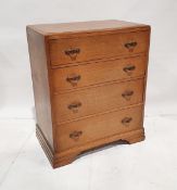 Early to mid 20th century limed oak chest of drawers, with four long graduated drawers, on bracket