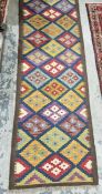 Maimana kilim blue ground runner with trelliswork of lozenge medallions , 207cm x 65cm