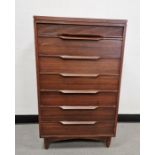 20th century teak White & Newton Plymouth chest of seven drawers raised on squat turned supports,