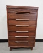 20th century teak White & Newton Plymouth chest of seven drawers raised on squat turned supports,