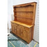 20th century pine dresser of two shelves over rectangular base, three short drawers over three