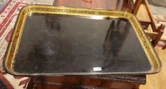 19th century black lacquered rectangular tray with gilt border, 71cm x 50cm (damage to one corner)