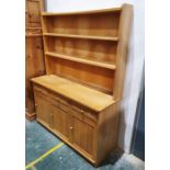 20th century oak dresser with two shelves above three short drawers over three cupboard on plinth