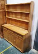 20th century oak dresser with two shelves above three short drawers over three cupboard on plinth