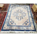 Large cream ground Chinese superwash carpet with centralised floral medallion enclosed by floral