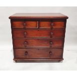 Victorian mahogany chest of drawers, the top with chamfered edge, over two short and three long