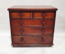 Victorian mahogany chest of drawers, the top with chamfered edge, over two short and three long