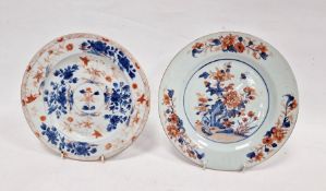 Two Chinese export Imari pattern plates, 18th century, each painted with flower sprays, one