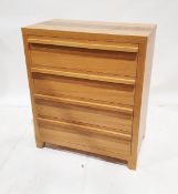 Contemporary oak veneered chest of drawers with four graduated long drawers, on tapering feet, 87.
