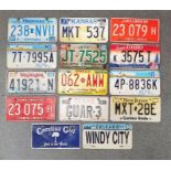 Small collection of US coloured metal car registration plates