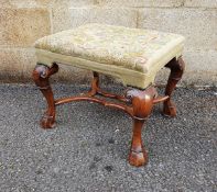 Carved walnut footstool in the early Georgian-style with rectangular tapestry top decorated with